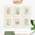 Neutral woodland animal nursery wall art prints set including deer, fox, rabbit, squirrel, birds nest and pine forest illustrations in natural wood frames above a white crib. Forest nursery decor, woodland baby room wall art, Scandinavian nursery prints, gender neutral nursery artwork, woodland animal gallery set, large printable wall art, digital download