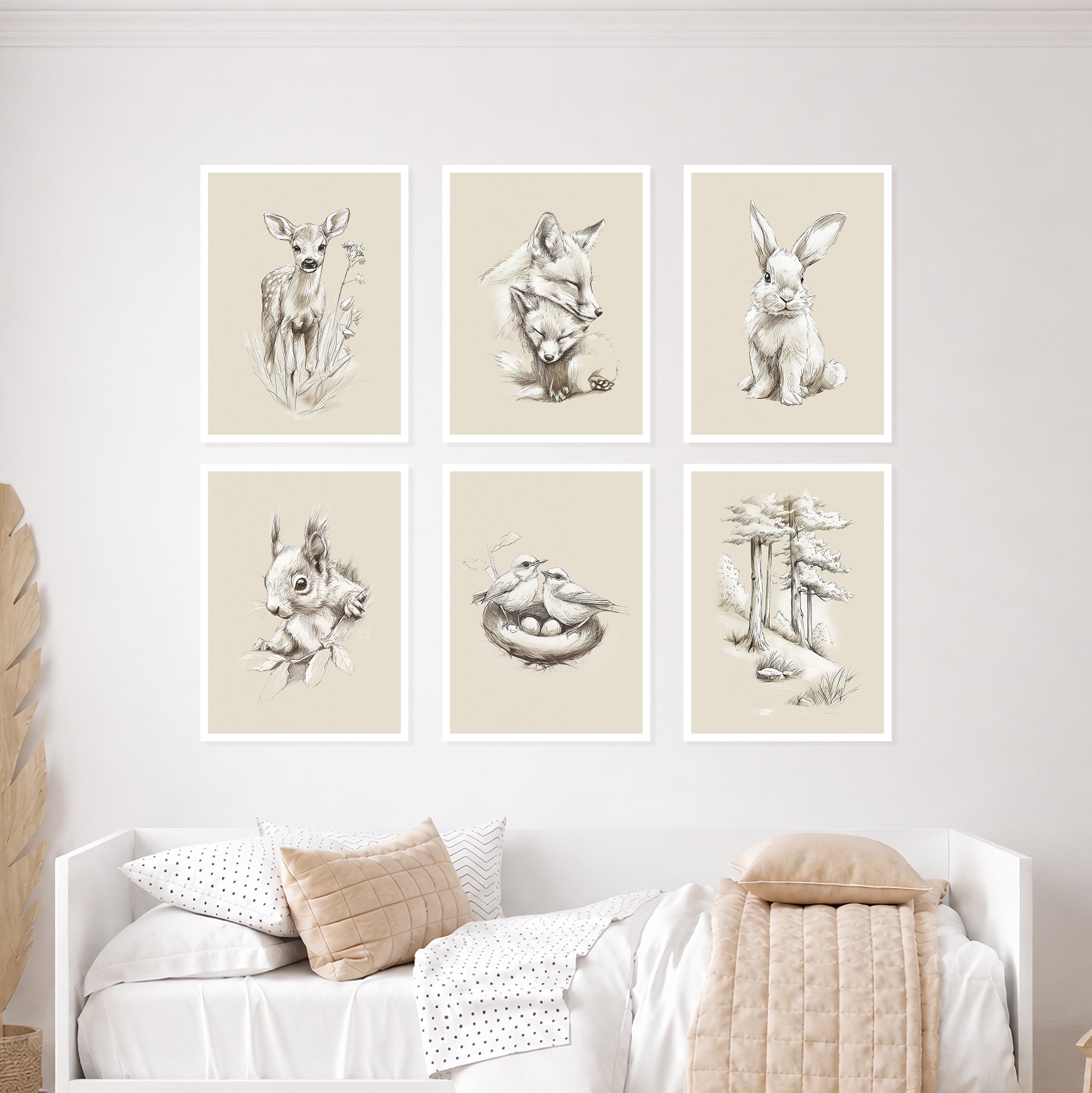 Woodland nursery wall art prints set of 6 featuring deer, fox, bunny, squirrel, birds nest and forest trees in neutral beige tones displayed above a children's bed. Scandinavian woodland animal prints for nursery decor, baby room wall art, gender neutral nursery, forest nursery artwork.