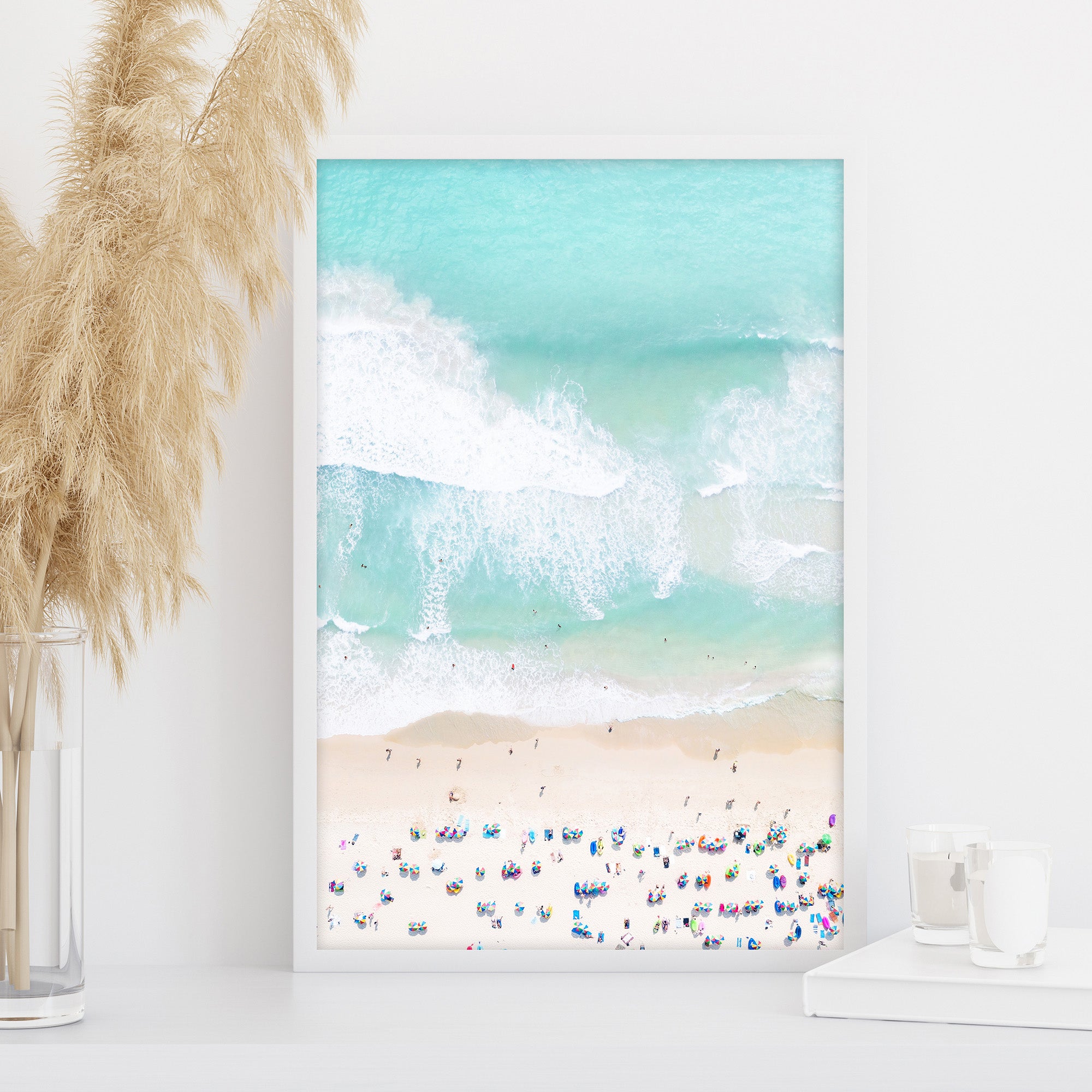 Aerial Beach wall art with gentle sea waves and pastel tones, people and umbrellas, coastal photography print, calm turquoise living room or bedroom wall art decor, large printable wall art
